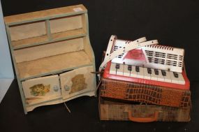 Group of Toys Including cabinet, train parts, accordion