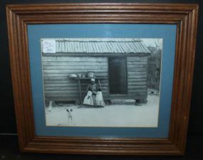 Woman and Children in Front of Sharecropper Shack 14