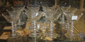 Set of Twelve Etched Glass Champagne Glasses One chipped