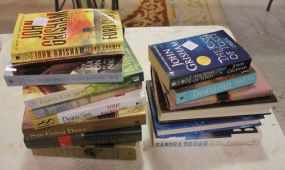 Group of Books including some by John Grisham and Daniel Steel.