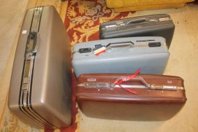 Four American Tourister Vintage Suitcases