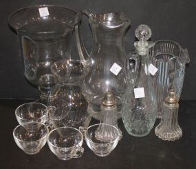 Lot of Glass shakers, cups, two pitchers, decanter, and vases.