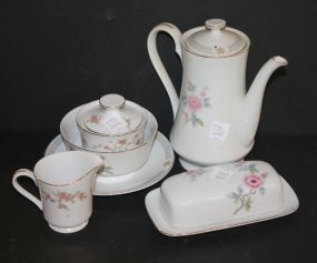 Several Pieces of Porcelain pot, butter dish, sugar, creamer, bowl, and plate.