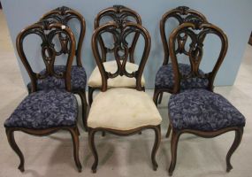 Set of Six Victorian Balloon Back Chairs Mid 19th century satinwood, rosewood, and ebonized side chairs. Top crest broken on three of the chairs. 19
