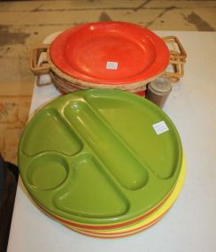 Set of Vintage Plastic Divided Plates Set of Six Vintage tin orange plates with wicker under plates, and vintage shaker.