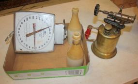 Scale, Torch, and Two Pub Bottles
