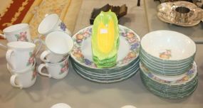 Epoch Collection 7 dinner plates, 7 bowls, 8 salad plates, 8 mugs, 4 corn-on-cob holders.