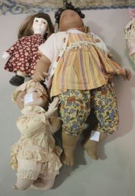 Group of Three Porcelain Dolls One praying boy 11