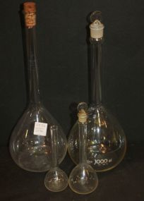 Group of Four Glass Lab Bottles
