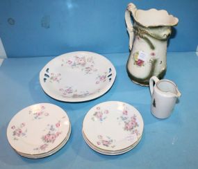 Seven Handpainted Germany Saucers, matching plate, pitcher, and ceramic pitcher.
