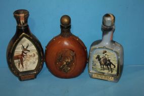 Three Whiskey Bottles