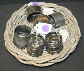 Six Silverplate Napkin Rings in a Basket
