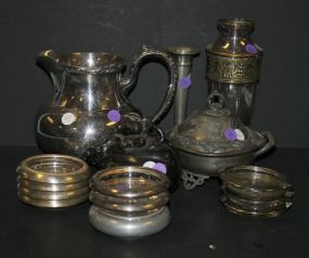 Silverplate Lot coasters, butter dish, pitcher, fruit, and pewter vase.