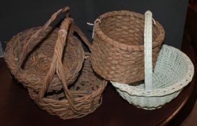 Group of Four Woven Baskets one in white