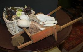 Basket with Fruit and Primitive Wheel Barrow with Antique Dolls
