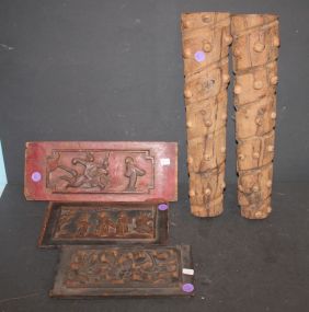Three Oriental Carved Plaques and two carved wall decorations