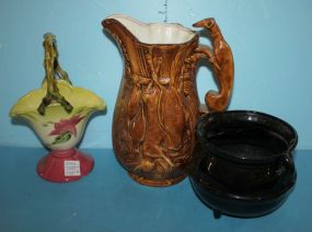 Three Pottery/Ceramic Pieces Ceramic Pitcher with hound head handle footed pot, hull basket with chip on base, 9