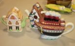 Teapot Collection Two house teapots, boat teapot.
