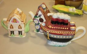 Teapot Collection Two house teapots, boat teapot.