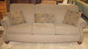 Upholstered Three Cushion Sofa has mahogany bunn feet