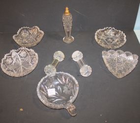 Nine Pieces of Cut Glass which includes: perfume, nappy, covered powder 5 1/2