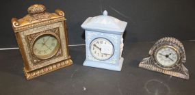 Three Small Clocks, Crystal Clock, Blue Porcelain Clock, and Gold Clock crystal clock 3 1/2