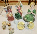 Resin Figurines and Two Small Ceramic Baskets Resin Figurines and Two Small Ceramic Baskets