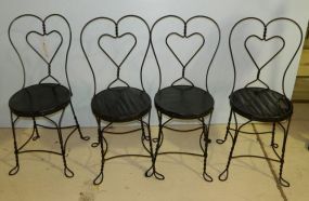 Set of Four Black Ice Cream Chairs has wooden seats