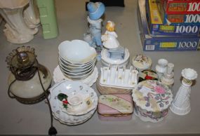 Lot of Miscellaneous Items Including Lamp base, boy figurine (missing arm) porcelain boxes, and vases.