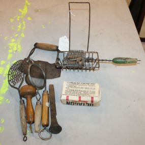 Grouping of Primitive Utensils meat chopper, strainer, ice pick, and soap dish