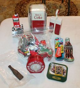 Group of Coke Collectibles include napkin holder and tins