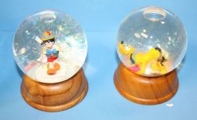 First Limited Edition Snow globes of Pluto and Pinocchio