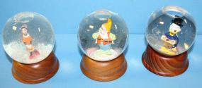 Three Limited Edition Disney Snow Globes