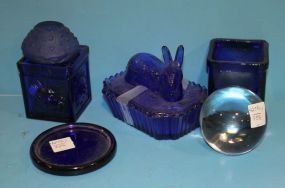 Six Cobalt Glass Pieces Covered rabbit dish, two candleholders, paperweight, flat, and round candle dish.