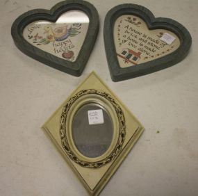 Two Prints in Heart Frames along with a Triangle Mirror