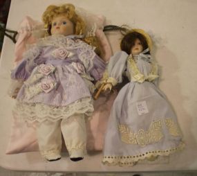 Two Dolls and Satin Bag