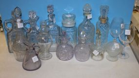 Large Group of Glass Decanters, Jars and Stoppers