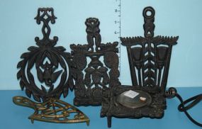 Iron Cup Warmer and Three Iron Trivets along with One Brass Trivet