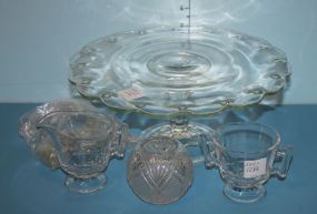 Glass Cake Stand, Creamer, Sugar, Six Salt Shakers and a Press Glass Rose Dish