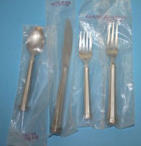 Gorham Pewter Flatware Pieces Four Gorham Pewter Flatware Pieces consisting of dinner fork, salad fork, spoon, and knife.