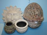 Two Pottery Jars and Two Pottery Wall Decorations