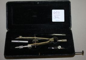 Vintage German Drafting Tool Compass Set in black leather case which is embossed 