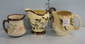 Sandland Ware-Lancaster Staffordshire Creamer, Myott Old Lusterware Pitcher, and a White Luster Pitcher with Flowers