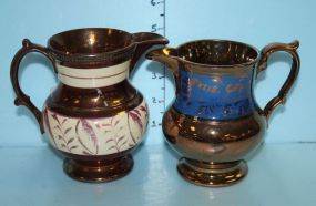 Two Luster Pitchers, One Copper and One Copper and Blue