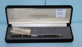Gold Pen with Gold Club on it and a money Clip in America's Leading Jeweler Case