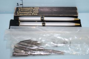 Two Chromatic 700 Executive Pens, a Bag of 1998 Fountain Pen Points, and a Set of Silver Pens in a Black Velvet Case