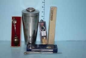 Group of Four Silverplate Souvenir Collector Spoons, Amsterdam, Towle, Las Vegas, International Letter Opener, and a Stainless Steel Shaker