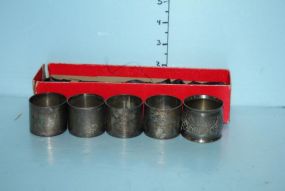 Group of Four Silverplate Napkin Rings