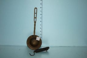 Brass Strainer and a Scale
