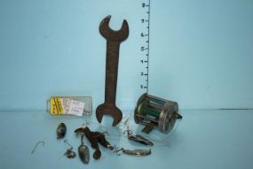 Fishing Lures, Reel, and a Rusted Wrench
